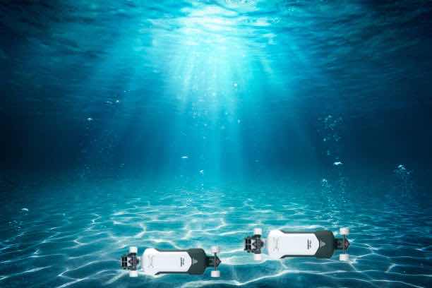 Illustration of two Aero Pro electric skateboards under the sea.